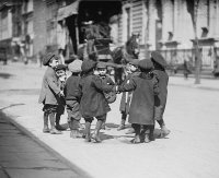 Young boys playing in a New York street, 1909. Source: Bain News Service.
